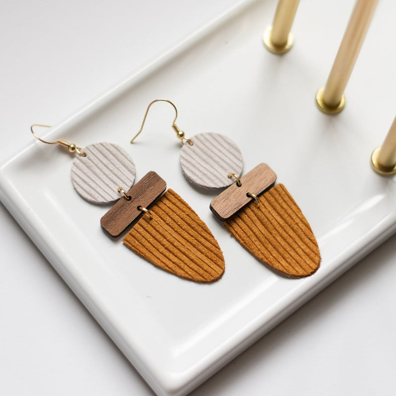 warm neutral big earrings leather wood fall colors sela designs